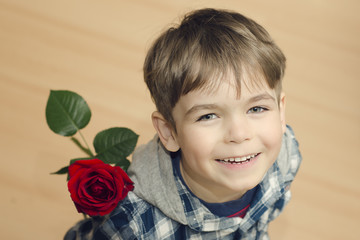 Chłopiec z różą - obrazy, fototapety, plakaty