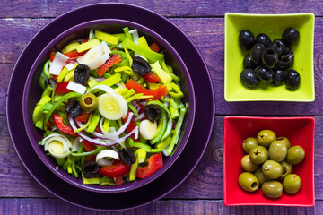 Fresh colorful vegetable salad platter wooden table