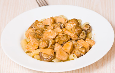 Penne pasta with mushroom and chicken breast