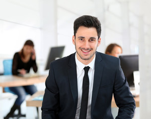 Portrait of young businessman in office