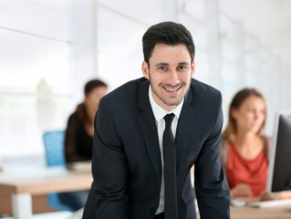 Fototapeta premium Portrait of young businessman in office