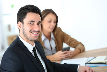 Portrait of smiling businessman having a meeting