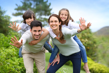 Fototapeta premium Happy family having fun in home garden
