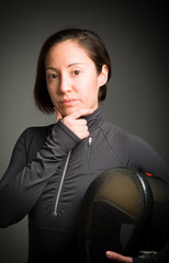 Female fencer thinking with hand on chin