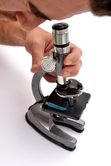 Man looking through a microscope