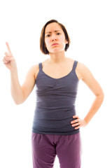 Fototapeta premium Young woman pointing her finger and thinking