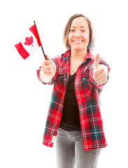 Young woman showing thumbs up sign with holding Canada flag