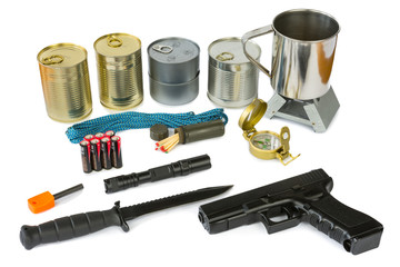 Survival kit with emergency supplies, flashlight and gun