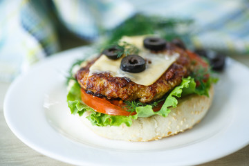 tasty hamburger with lettuce and tomato