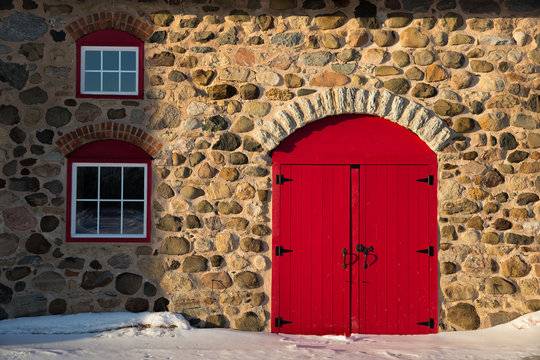 Old Stone Barn with Bright Red Door