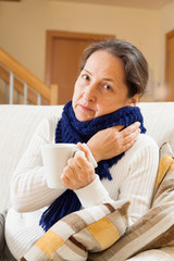  woman drinking hot tea at home