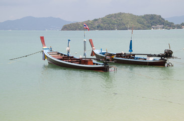 Fototapeta premium Thai traditional wooden boat in Panwa bay, Phuket, Thailand