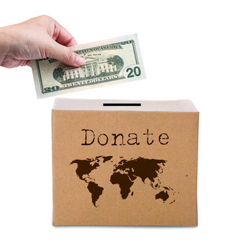 Human Hand Putting Money In Brown Donate Box With World Map Eart