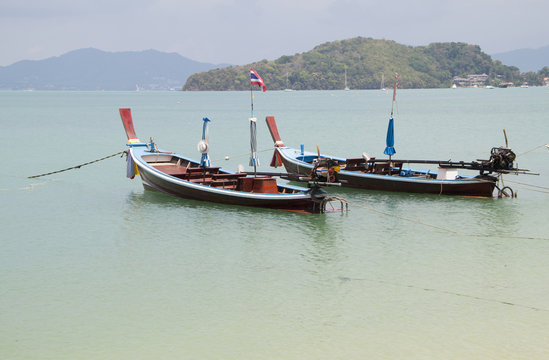 Thai traditional wooden boat  in Panwa bay, Phuket, Thailand