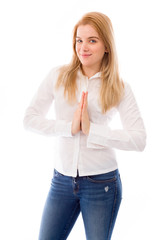 Fototapeta premium Young woman standing in prayer position
