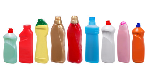 colorful plastic bottles of cleaning products on white