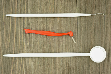 Dental instruments for cleaning plaque with mirror