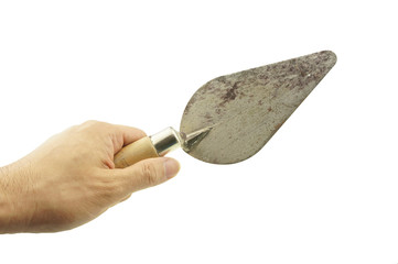 Hand hold old trowel isolated