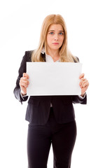 Fototapeta premium Upset businesswoman holding a blank placard isolated on white ba
