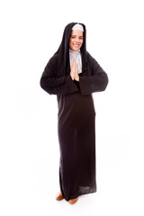 Young woman welcoming with hands clasped