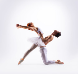 Couple of ballet dancers isolated on white