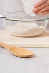 female hands knead the dough