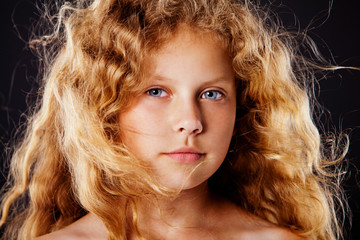 Fototapeta premium Portrait of pretty little girl with windy hair. Fashion photo