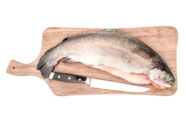 raw salmon trout fish on cutting board