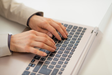 Fototapeta na wymiar Closeup on business woman working on laptop