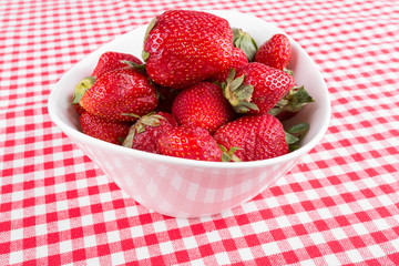 strawberries in a bowl on the table