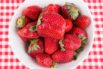 strawberries in a bowl on the table