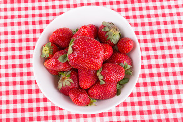 strawberries in a bowl on the table