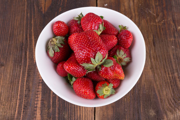strawberries in a bowl on the table