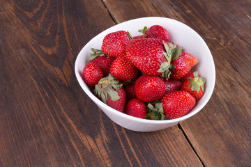 strawberries in a bowl on the table