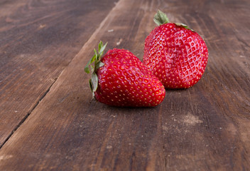 two red strawberries on the table