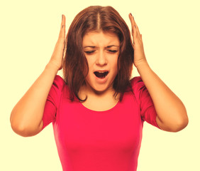 brunette woman covering her ears with her hands screaming opened