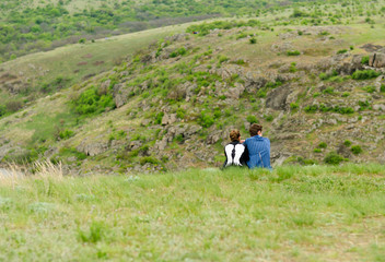 Romantic couple sitting enjoying the outdoors