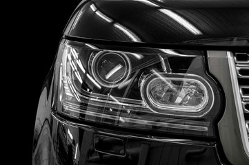 Closeup headlights of car.