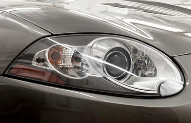 Closeup headlights of car.