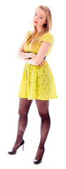 Beautiful young woman standing with her arms crossed