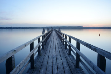 Beautiful view on a wooden pier at the Ammersee, Germany, Bavaria