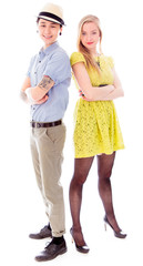 Lesbian couple standing back to back with her arms crossed