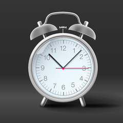 Vintage alarm clock on grey background