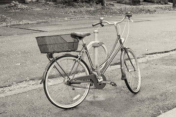 Fototapeta na wymiar Women's bicycle parked on the street
