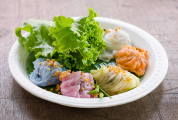 Steamed rice skin dumplings, Thai style dessert on wood table