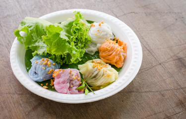 Steamed rice skin dumplings, Thai style dessert on wood table