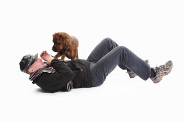 Mature Man Lying On Back With Dog