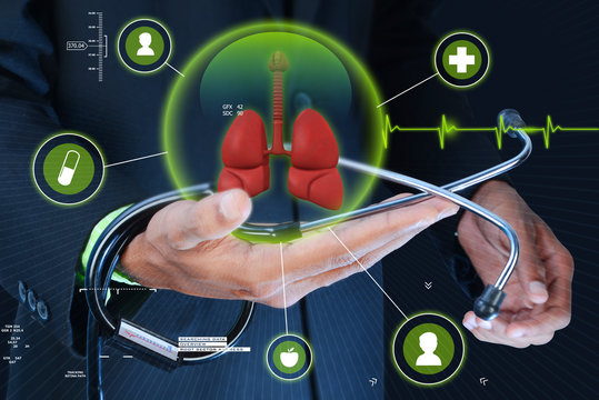Smart hand showing human lungs and stethoscope