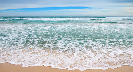 waves sea and yellow sand
