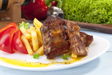 Grilled ribs on plate